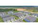 This aerial displays the community's modern townhomes, parking areas, manicured lawns, and green spaces at 275 Blueberry Ln, Davenport, FL 33837