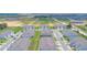 A wide aerial perspective of attractive townhomes with sidewalks, landscaping, and convenient parking at 275 Blueberry Ln, Davenport, FL 33837