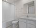 Bright bathroom with white vanity, toilet, and shower with tiled walls at 275 Blueberry Ln, Davenport, FL 33837