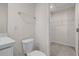 Bathroom features a toilet next to the vanity and a walk-in closet at 275 Blueberry Ln, Davenport, FL 33837