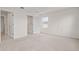 Bedroom featuring carpet, neutral walls, and an attached closet with an ensuite bathroom at 275 Blueberry Ln, Davenport, FL 33837