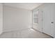Carpeted bedroom offers natural light from a window and features a closet at 275 Blueberry Ln, Davenport, FL 33837