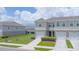Charming townhome boasting a one-car garage and lush lawn at 275 Blueberry Ln, Davenport, FL 33837