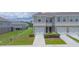 Lovely townhome featuring an attached garage and manicured landscaping at 275 Blueberry Ln, Davenport, FL 33837