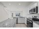 Kitchen featuring stainless steel appliances, granite countertops, and bright natural light at 275 Blueberry Ln, Davenport, FL 33837