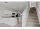 Bright kitchen with white cabinets, stainless appliances, granite countertops, and tiled floor at 275 Blueberry Ln, Davenport, FL 33837