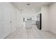 Open living space featuring tile flooring, recessed lighting, and modern white doors at 275 Blueberry Ln, Davenport, FL 33837