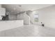 A spacious living area with tile floors and stairs to the second floor, filled with natural light at 275 Blueberry Ln, Davenport, FL 33837