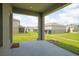View of the patio, community, and green spaces at 275 Blueberry Ln, Davenport, FL 33837