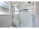 A glass shower boasting white tile and a built-in bench at 2767 Aragon Ter, Lake Mary, FL 32746