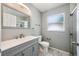 Updated bathroom features a gray vanity, new faucet, toilet, and glass enclosed shower at 2767 Aragon Ter, Lake Mary, FL 32746