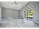 Spacious bedroom with white tile floors and glass sliding door leading to a screened area at 2767 Aragon Ter, Lake Mary, FL 32746