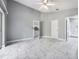 Spacious bedroom with white tile floors and views to the kitchen and bathroom at 2767 Aragon Ter, Lake Mary, FL 32746