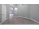 Hallway with modern flooring and arched entryway showcasing architecture with built in shelves at 2767 Aragon Ter, Lake Mary, FL 32746