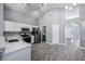 Bright kitchen featuring stainless steel appliances and view to the front door and hallway at 2767 Aragon Ter, Lake Mary, FL 32746