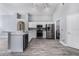 Bright kitchen featuring stainless steel appliances, white cabinetry and laundry space at 2767 Aragon Ter, Lake Mary, FL 32746