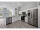 Bright kitchen featuring stainless steel appliances, white cabinetry, and an open design at 2767 Aragon Ter, Lake Mary, FL 32746