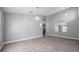 Spacious, light-filled living room with open floorplan, archways and modern wood-look flooring at 2767 Aragon Ter, Lake Mary, FL 32746