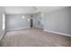 Spacious living room featuring vaulted ceiling, and elegant archways complemented by light gray walls and stylish wood floors at 2767 Aragon Ter, Lake Mary, FL 32746