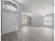 Bright living room showcasing beautiful wood-look floors, high ceilings and clerestory windows at 2767 Aragon Ter, Lake Mary, FL 32746