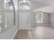 Bright living room showcasing beautiful wood-look floors, high ceilings and clerestory windows at 2767 Aragon Ter, Lake Mary, FL 32746