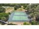 Overhead view of community tennis courts surrounded by trees and green space at 2767 Aragon Ter, Lake Mary, FL 32746
