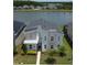Beautiful two-story home with water view, modern design with stone accents and well-manicured landscaping at 2855 Bookmark Dr, Kissimmee, FL 34746