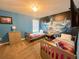bedroom with carpet, and two twin beds with 'Frozen' themed wall art at 2855 Bookmark Dr, Kissimmee, FL 34746