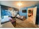 bedroom with two twin beds and Frozen themed wall art, and doorway to bonus room at 2855 Bookmark Dr, Kissimmee, FL 34746