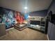 bedroom with carpet, 'Star Wars' mural wall and bunk and twin bed at 2855 Bookmark Dr, Kissimmee, FL 34746