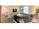 The neutral bedroom has a queen bed, lamps, dresser, a window, and a television at 2855 Bookmark Dr, Kissimmee, FL 34746