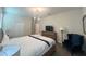 Bedroom featuring modern lighting, television, dresser, and cozy blue armchair at 2855 Bookmark Dr, Kissimmee, FL 34746