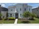 Charming two-story home featuring modern design with stone accents and well-manicured landscaping at 2855 Bookmark Dr, Kissimmee, FL 34746
