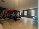 Game room with pool table, superhero mural, and neutral tiled floors at 2855 Bookmark Dr, Kissimmee, FL 34746
