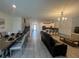 Open-concept living and dining area featuring modern tile flooring and abundant natural light at 2855 Bookmark Dr, Kissimmee, FL 34746