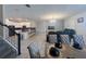 Open-concept living and dining area featuring modern tile flooring and abundant natural light at 2855 Bookmark Dr, Kissimmee, FL 34746