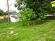 Backyard area with mature trees and a shed at 3017 Lambath Road, Orlando, FL 32818