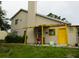 Back exterior of home with small pergola and access to backyard at 3017 Lambath Road, Orlando, FL 32818