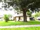 Inviting two-story home with mature trees and a well-maintained front lawn at 3017 Lambath Road, Orlando, FL 32818