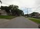 Neighborhood street view with well-maintained homes and landscaping at 3017 Lambath Road, Orlando, FL 32818