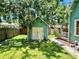 Spacious backyard with a shed and lush greenery, providing a private outdoor retreat at 311 W 10Th St, Sanford, FL 32771