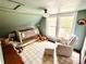 Bright Bedroom room with crib, chair, ottoman and ample natural light from the windows at 311 W 10Th St, Sanford, FL 32771