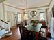 Inviting dining room featuring a classic chandelier and access to staircase at 311 W 10Th St, Sanford, FL 32771