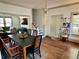 Charming dining area with adjacent living room, staircase, and front door at 311 W 10Th St, Sanford, FL 32771