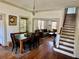 Open-concept dining room connecting to the living room and featuring staircase at 311 W 10Th St, Sanford, FL 32771