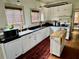 Bright kitchen features white cabinets, modern appliances, and a functional center island at 311 W 10Th St, Sanford, FL 32771