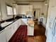 Spacious kitchen featuring white cabinets, black countertops and a movable island at 311 W 10Th St, Sanford, FL 32771
