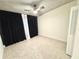 Bedroom with an open closet, bright light, and neutral colored walls at 319 Halsey St, Orlando, FL 32839