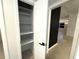 Organized closet with shelving and white painted walls at 319 Halsey St, Orlando, FL 32839