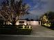 Inviting home exterior with manicured lawn and illuminated features at 319 Halsey St, Orlando, FL 32839